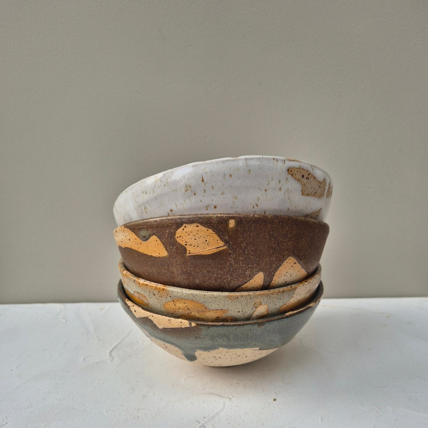 stuck of different colour ceramic bowls