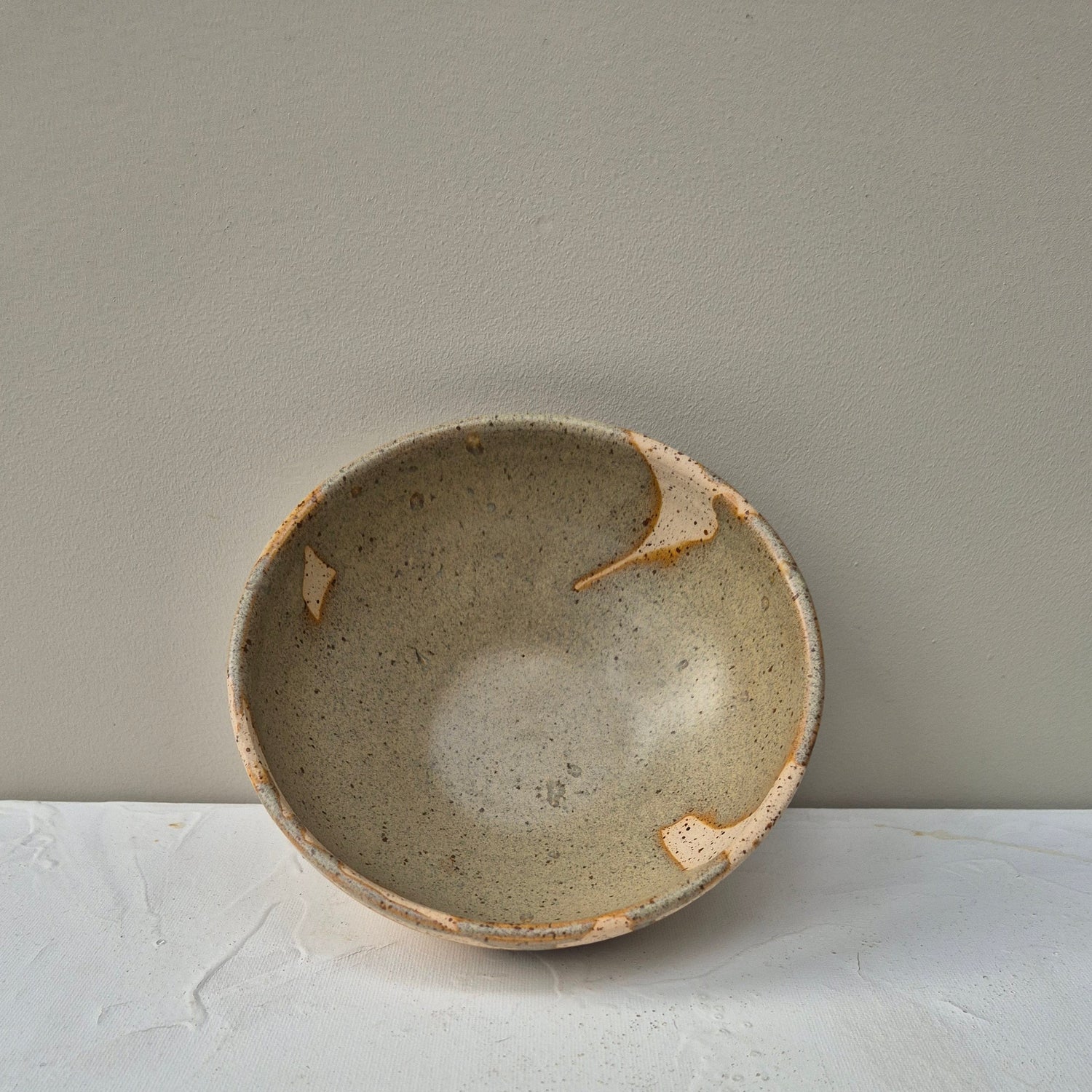 Small ceramic bowl on a light gray background